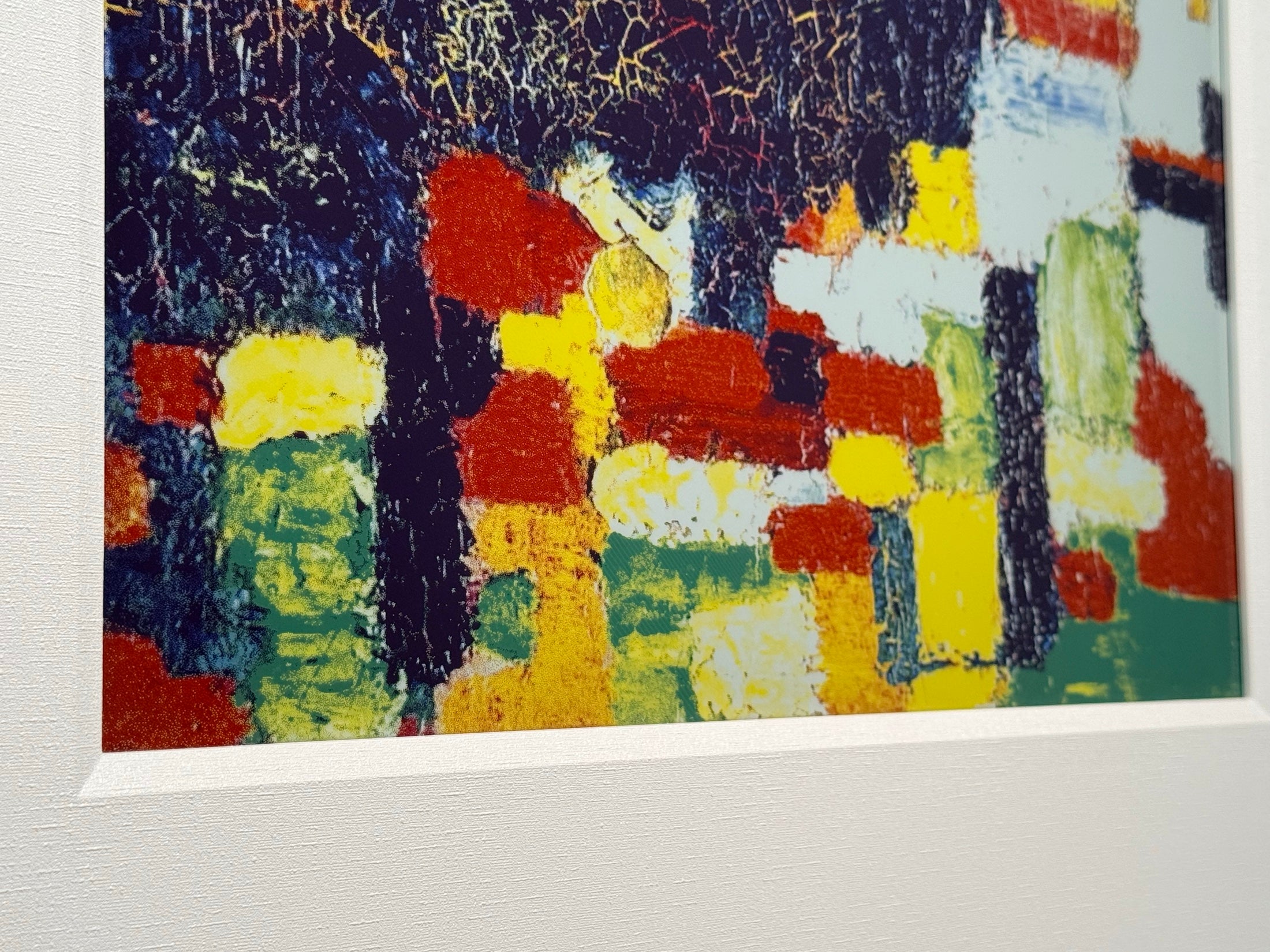 Close detail of colour pigment and paper-like texture on a BLOOMIN8 canvas